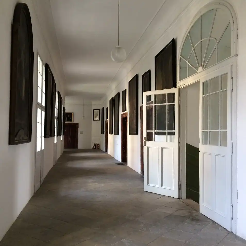 walking the corridors of osek monastery.webp
